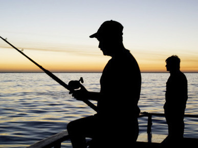 Fishing for Yellowfin Tuna from a Boat in Pre Dawn Light